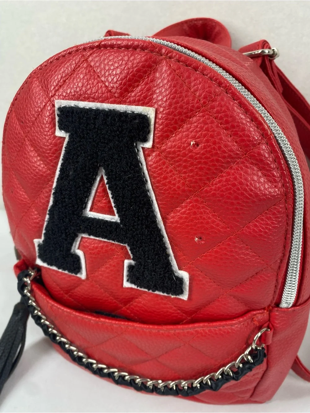 Justice Red Quilted Mini Backpack with Black Patch
